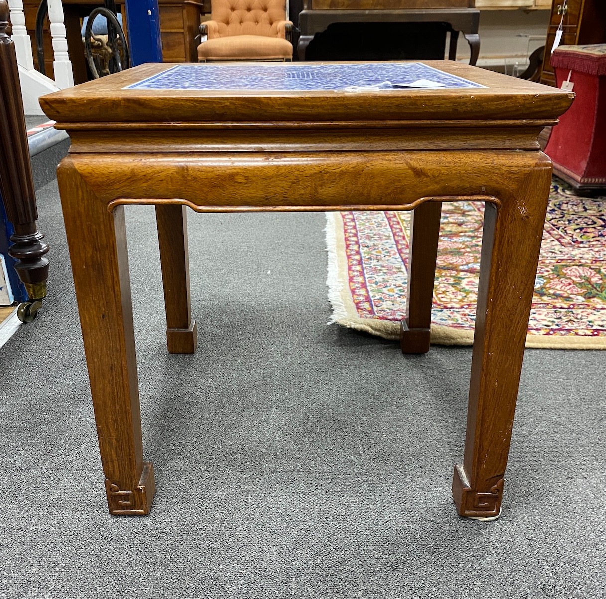 A Chinese hardwood and underglaze blue porcelain tile inset table, width 42cm, depth 42cm, height 43cm